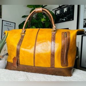 This exquisite travel bag, crafted entirely from premium leather and  handmade